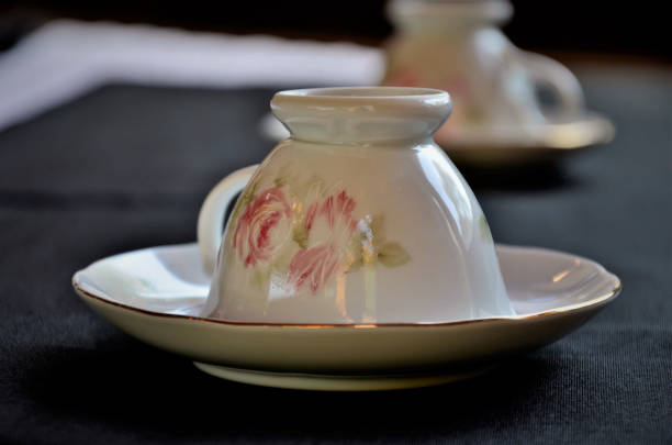 istock Beautiful classic cup with flower design 1290085107