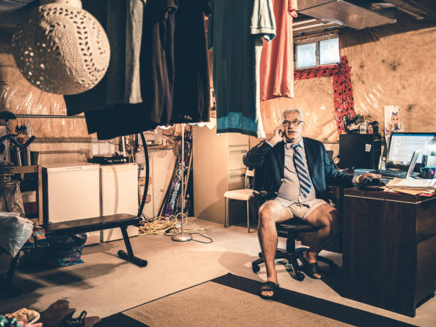 istock Mature man at work in his basement office 1290085996