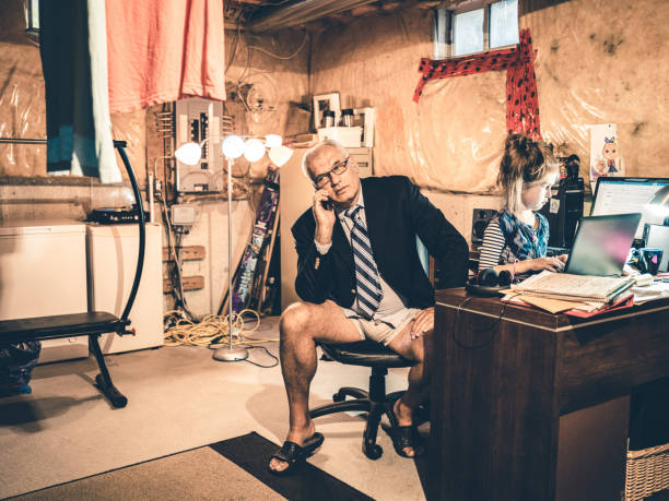 istock Dad and Daughter at work in his basement office 1290086091