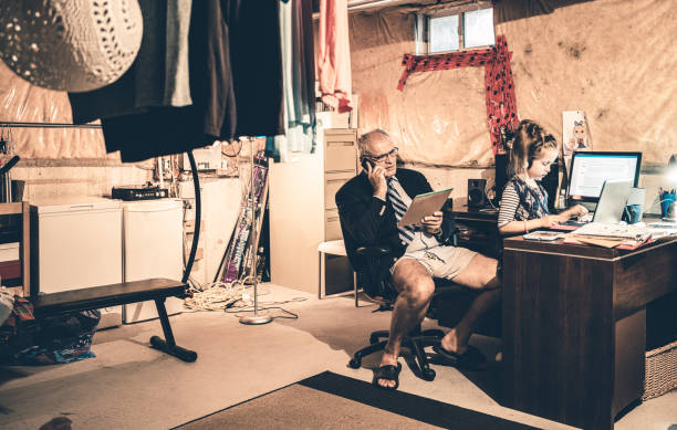 istock Dad and Daughter at work in his basement office 1290086211
