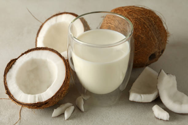 istock Fresh coconut and coconut milk on white background 1290090515