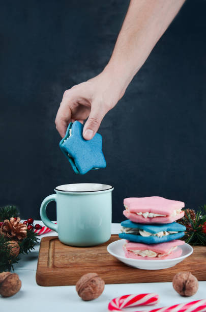 istock Female hand holding christmas star cookie 1290091714