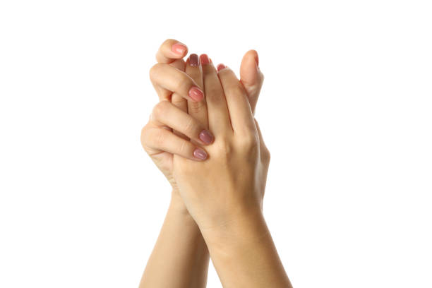 istock Cute female hands with pink manicure isolated on white background 1290092223