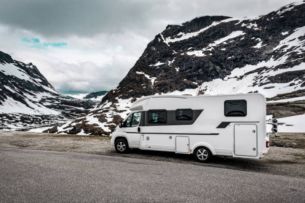 istock camper van in the snowy mountains 1290092967