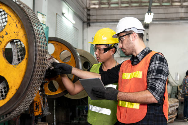 istock Engineer search data and conduct from tablets for solution process of product in factory with confident 1290093494