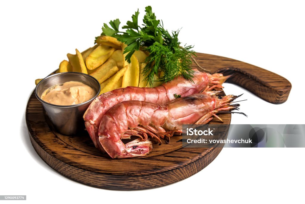 delicious shrimps with potato on white delicious large shrimps prawn with potato isolated on white Large Stock Photo
