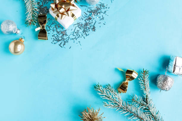 istock Christmas composition with gifts and decorations on blue background, top view, copy space 1290095521