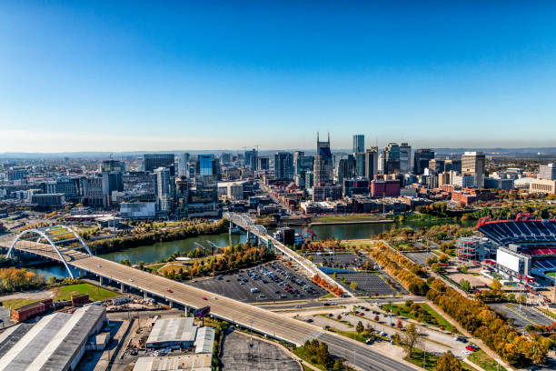 Nashville Skyline Aerial The skyline of beautiful Nashville, Tennessee, known as "Music City" along the banks of the Cumberland River. nashville tennessee bridge stock pictures, royalty-free photos & images