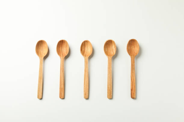 istock Empty wooden spoons on white background, top view 1290095841