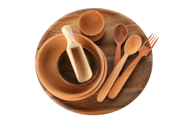 istock Different wooden dishes isolated on white background 1290095854