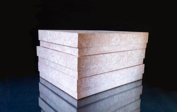 istock The Box from paperboard on turn blue the table with reflection. 1290096986