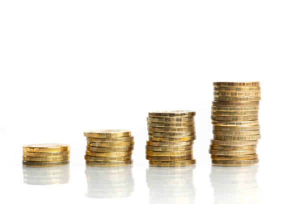 istock Columns of stacked coins showing growing graph 1290097567