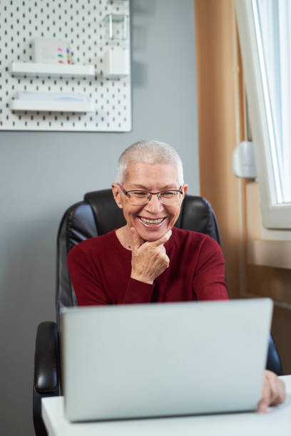 istock Elderly lady having a video call with her family 1290097810