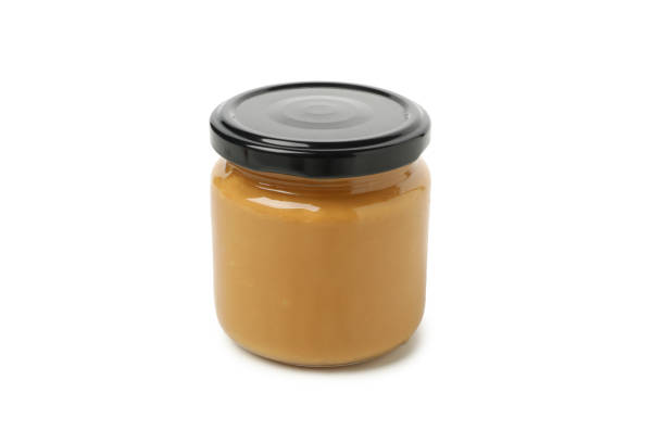 istock Jar with peanut butter isolated on white background 1290098987