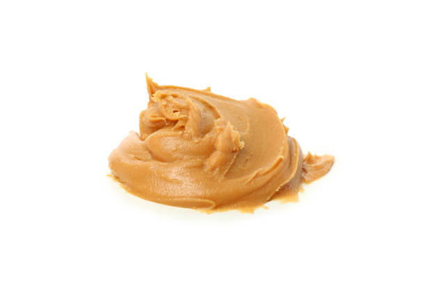 istock Tasty peanut butter isolated on white background 1290099261