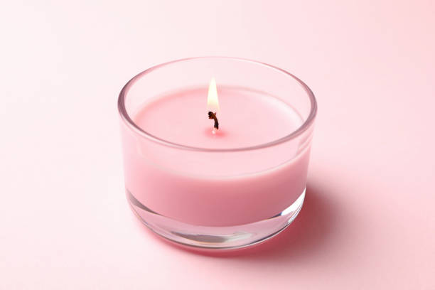 istock Scented candle for relax on pink background 1290100624