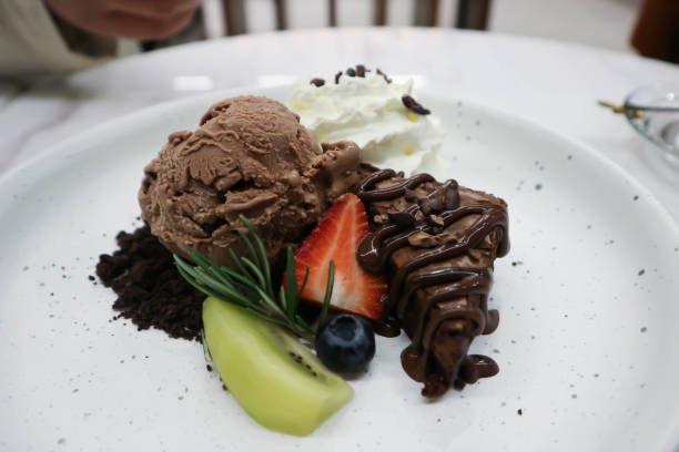 istock brownie , chocolate ice cream with whipping cream 1290101308