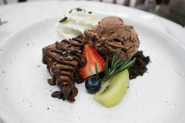 istock brownie , chocolate ice cream with whipping cream 1290101309