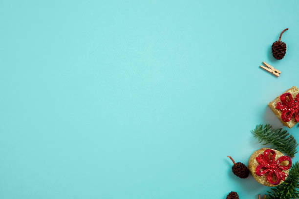 istock Holiday decorations on blue background top view. Christmas greeting card. 1290101378