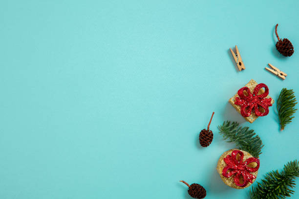 istock Holiday decorations on blue background top view. Christmas greeting card. 1290101387