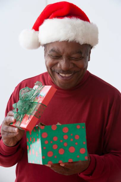 istock Senior African american man wearing a santa hat 1290102948