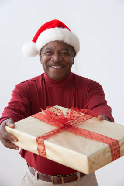 istock Senior African american man wearing a santa hat 1290102952