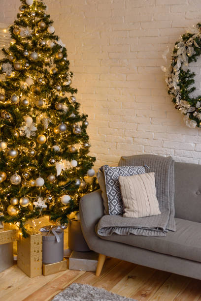 istock Beautiful holdiay decorated room with Christmas tree with presents under it 1290103252