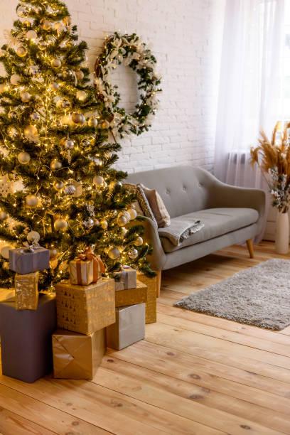 istock Beautiful holdiay decorated room with Christmas tree with presents under it 1290103261
