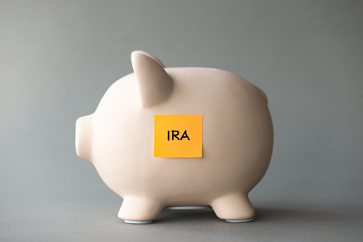 Piggy bank with IRA. The German retirement and pension system .
