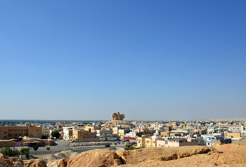 Al-Qarah, Al-Hofuf, Al-Ahsa Oasis, Eastern Province, Saudi Arabia: town skyline and Hill of the Heads - Ras Al-Qarah mount, view from the top of the Al-Qarah mountain, UNESCO world heritage site.