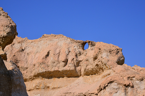 Al-Qarah, Al-Hofuf, Al-Ahsa Oasis, Eastern Province, Saudi Arabia: erosion in progress, camel head rock formation - Al-Qarah mountain / Jabal Al-Qarah, UNESCO world heritage site