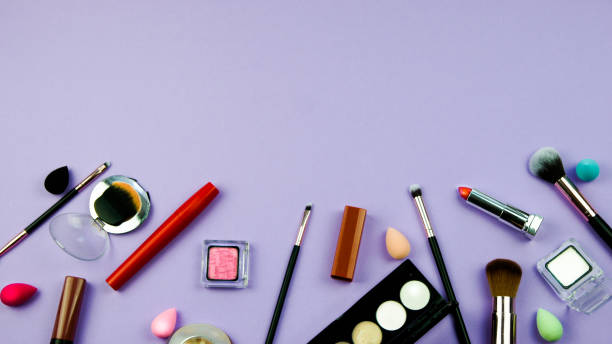 istock lots of makeup on a purple background 1290109761