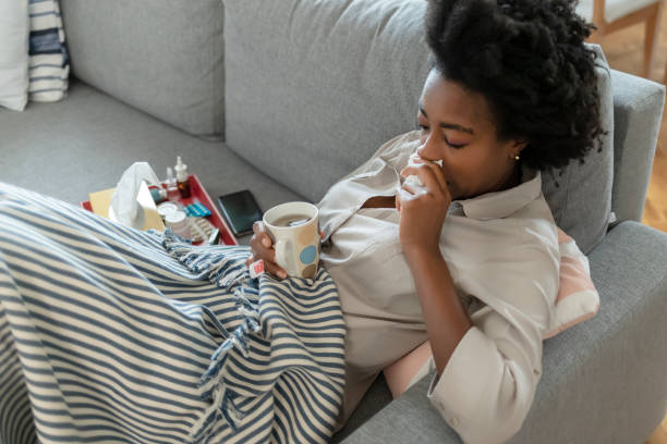 istock Sick young woman at home 1290114900