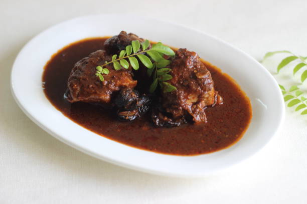 istock Red colour spicy fish curry prepared in Kerala style 1290115220