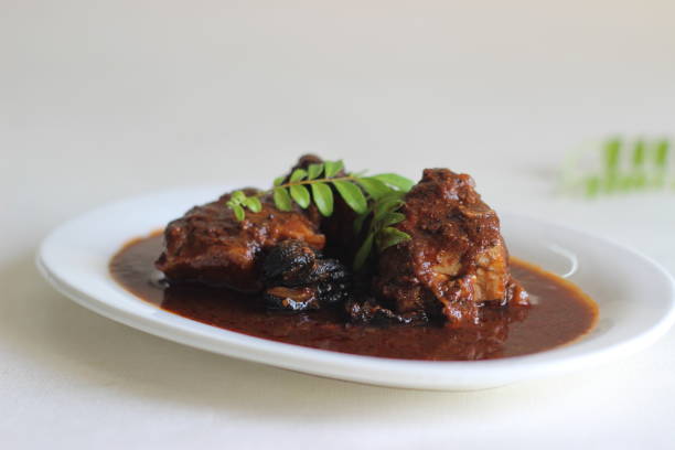 istock Red colour spicy fish curry prepared in Kerala style 1290115449