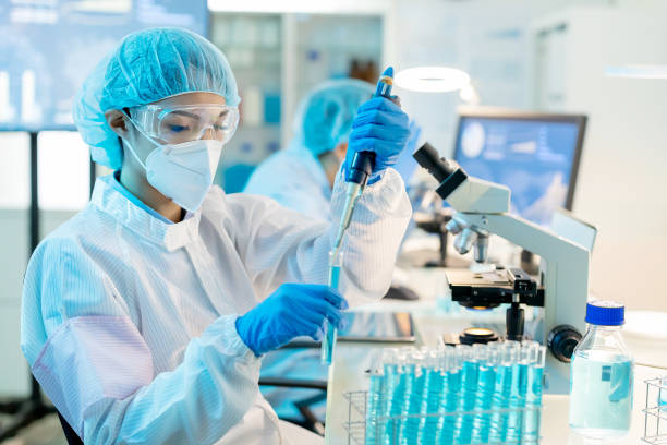 istock asian scientist take test tube 1290116268