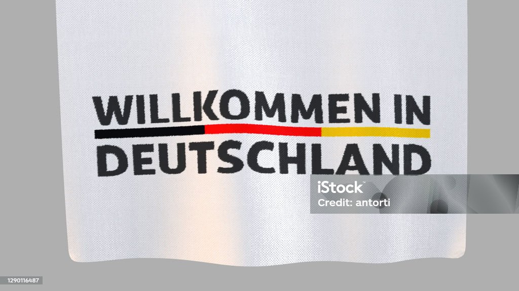 Willkommen in Deutschland (welcome to Germnany) unfolding cloth sign. Clipping path included so you can put your own background. Advertisement Stock Photo