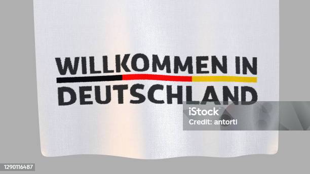 Willkommen In Deutschland Unfolding Cloth Sign Clipping Path Included So You Can Put Your Own Background Stock Photo - Download Image Now