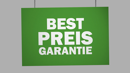 Bestpreis garantie (best price guarantied) german cardboard sign hanging from ropes. Clipping path included so you can put your own background.
