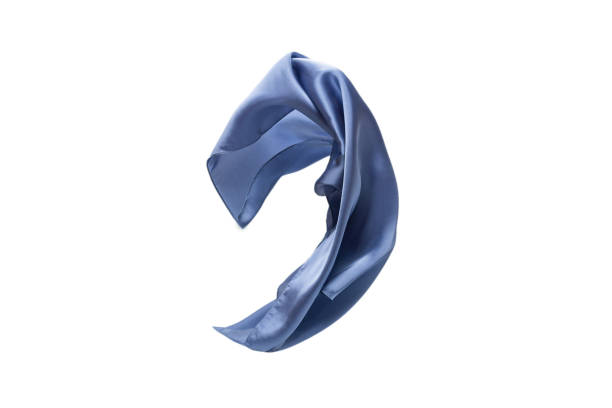 istock Flowing blue silk scarf isolated on white background. 1290119755