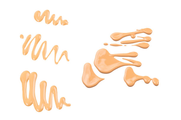 istock Liquid foundation swatch isolated on white background. Close Up of makeup cream sample. 1290119762
