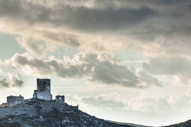 Greece Mani Peninsula. Traditional style stone tower house on hill against sky. Laconia Peloponnese, Europe