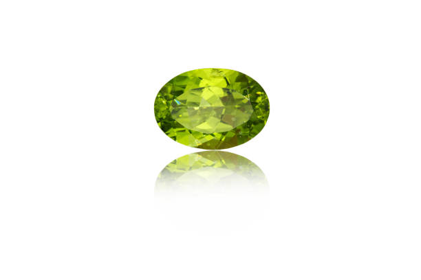 macro mineral stone cut Peridot on a white background