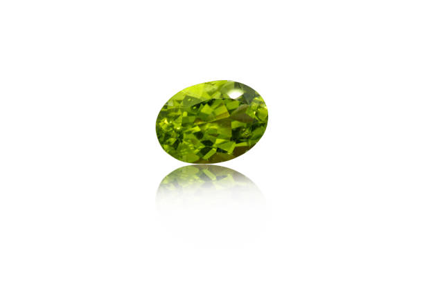 istock macro mineral stone cut Peridot on a white background 1290120836