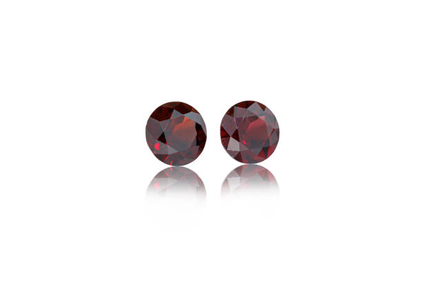istock macro mineral stone cut Garnet on a white background 1290121191