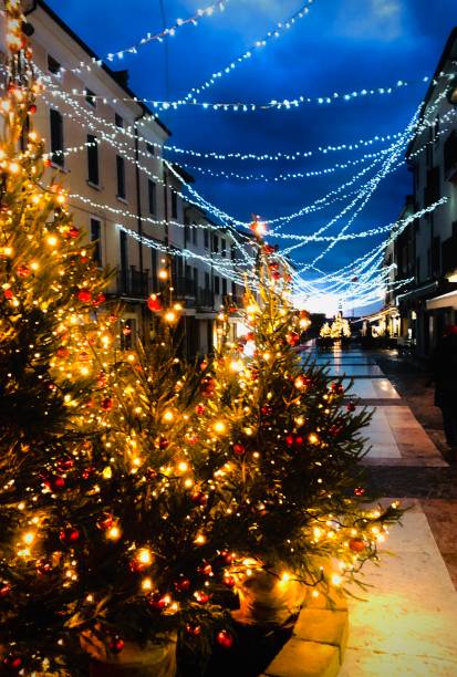 istock rain in the street illuminated by Christmas lights 1290121231