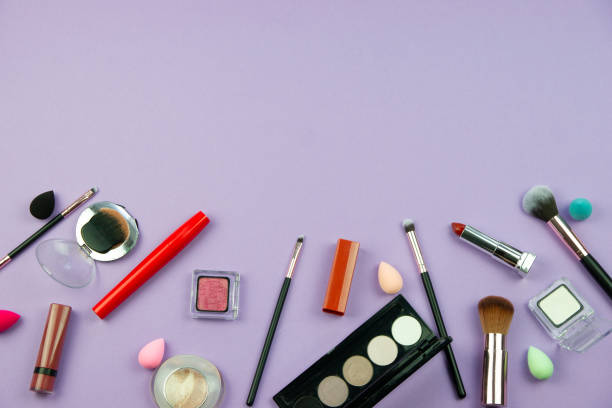 istock lots of makeup on a purple background 1290122449