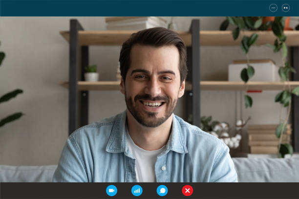 istock Head shot portrait screen view smiling young man chatting online 1290123041