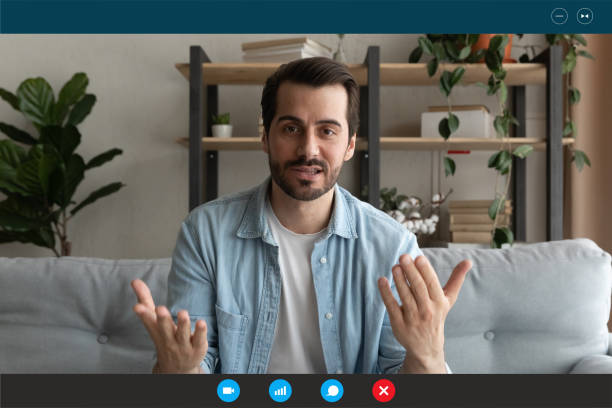 istock Head shot portrait screen view man teacher speaking online 1290123047
