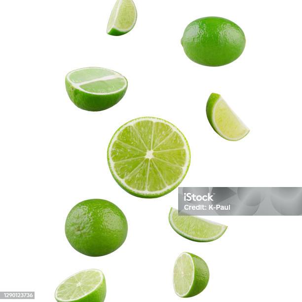 Set Of Falling Limes Isolated On White Background Stock Photo - Download Image Now - Lime, Slice of Food, Falling